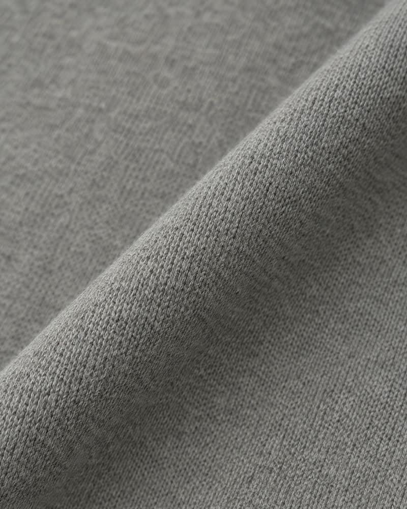 Macro of stone grey organic cotton interlock knit