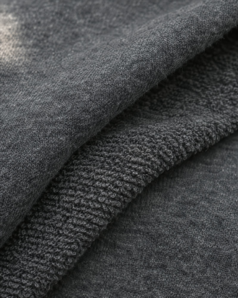Macro of charcoal organic cotton loopback fleece, face and loops